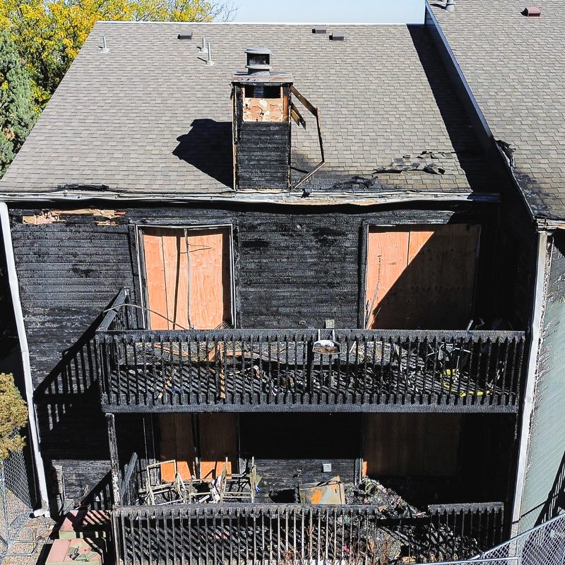 Charred exterior and burnt-out balconies after the fire