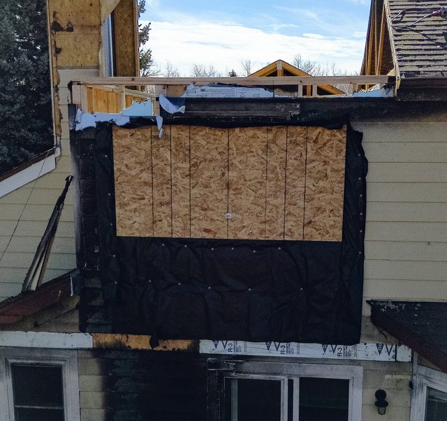 The same elevation from the opposite angle, wrapped and boarded