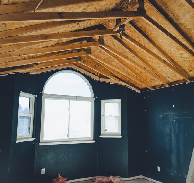 The vaulted framing and arched window from the far side of the room