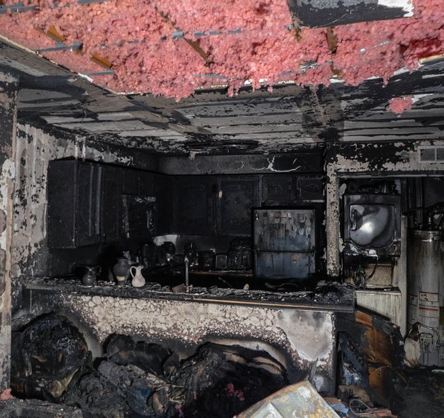 Fire-damaged interior stripped back before encapsulation