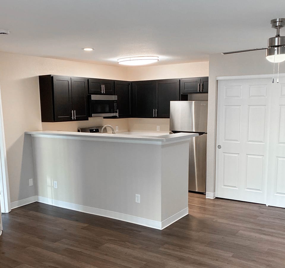 Rebuilt kitchen with new cabinets, counters, appliances and flooring