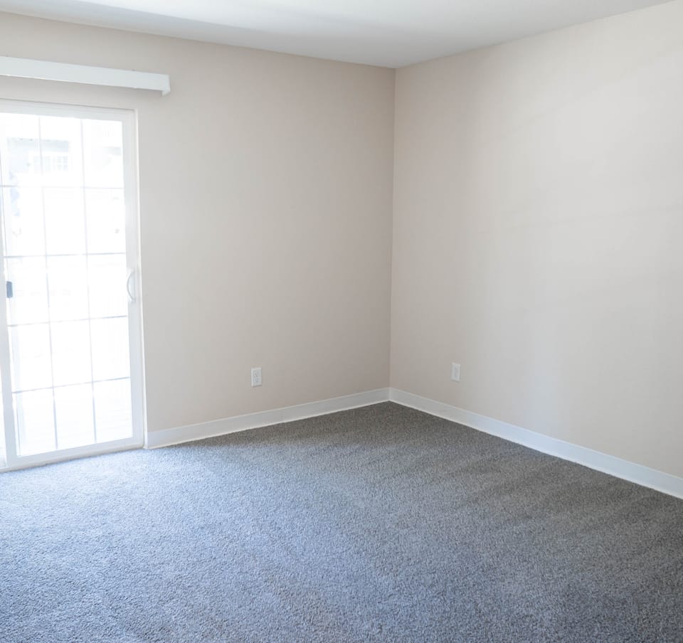 Restored bedroom with new carpet, paint and trim