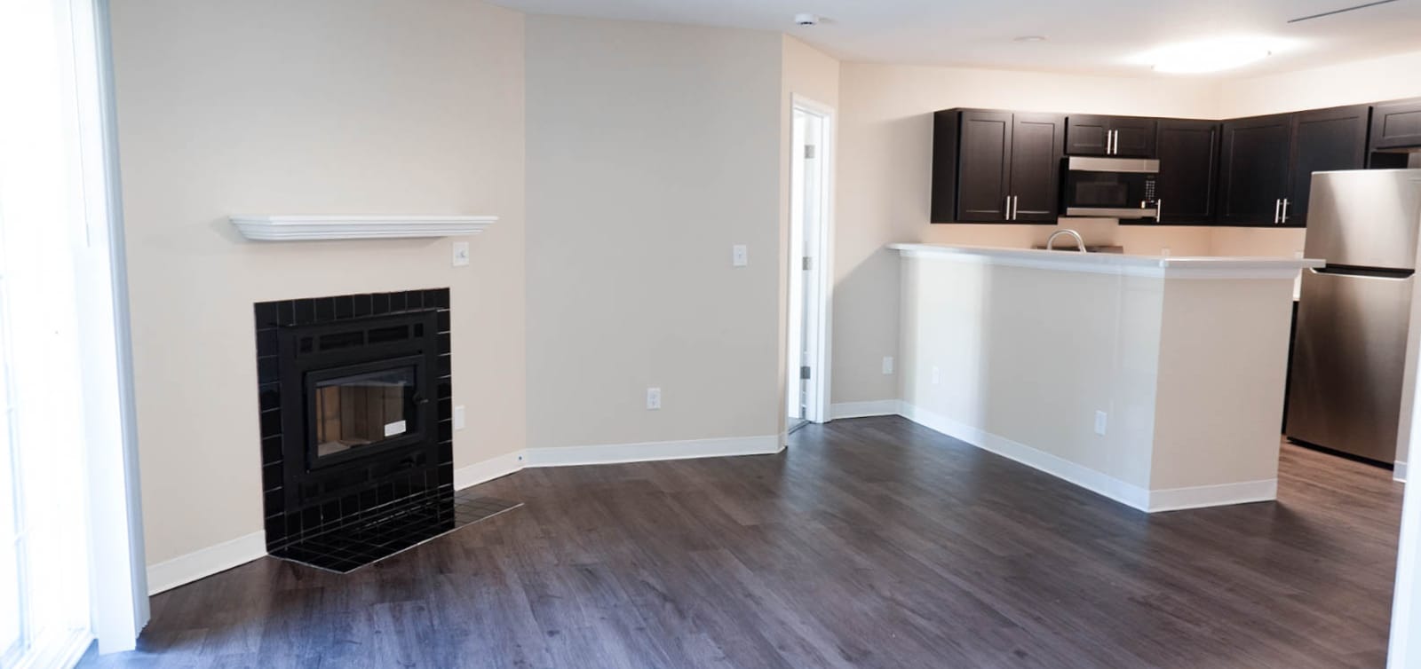 Finished living room and kitchen with the fireplace restored
